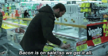 man putting lots of on sale bacon into his grocery cart, on loop