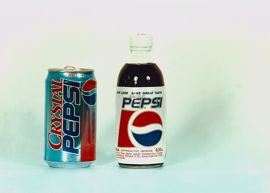 A can of Crystal Pepsi next to a bottle of Pepsi