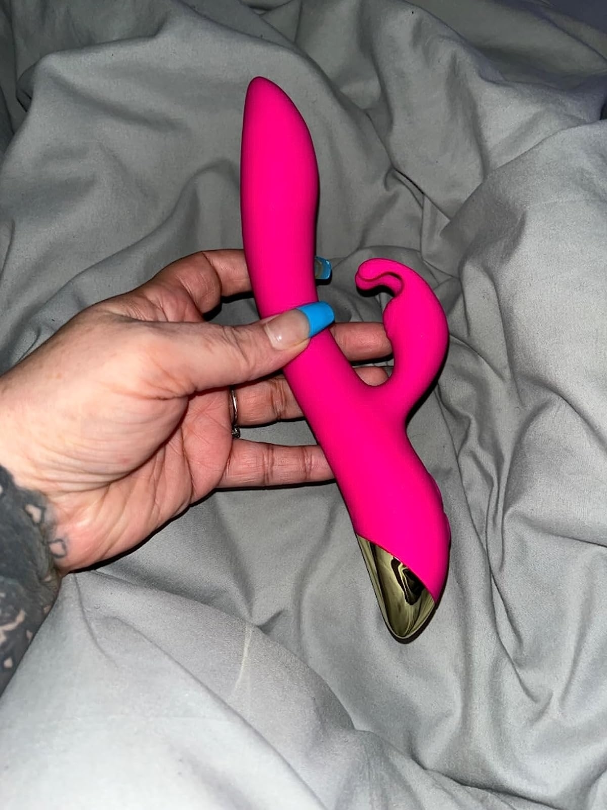 Reviewer holding pink rabbit vibrator