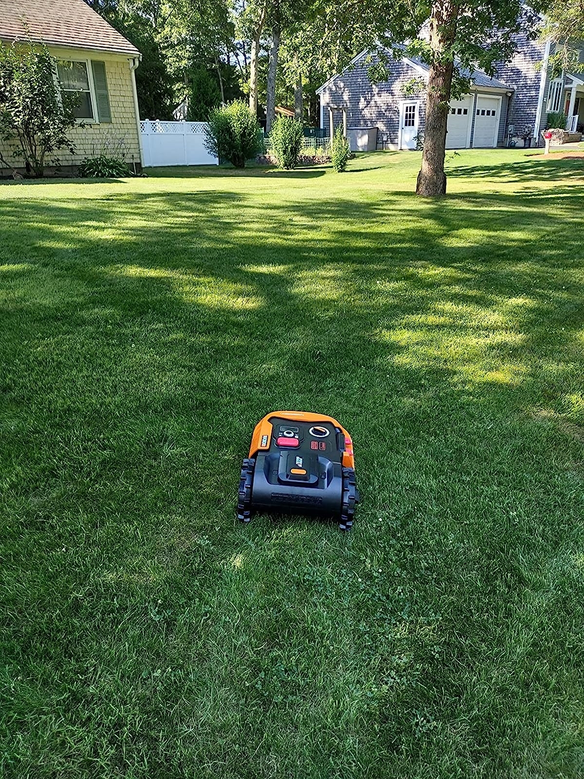 reviewer photo of the robot lawn mower on grass