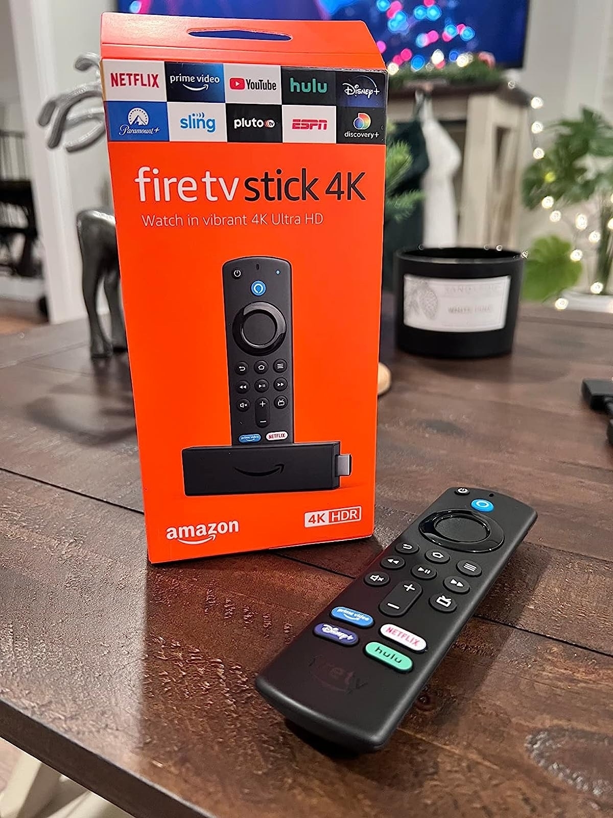 reviewer image of the fire TV stick on a wooden table