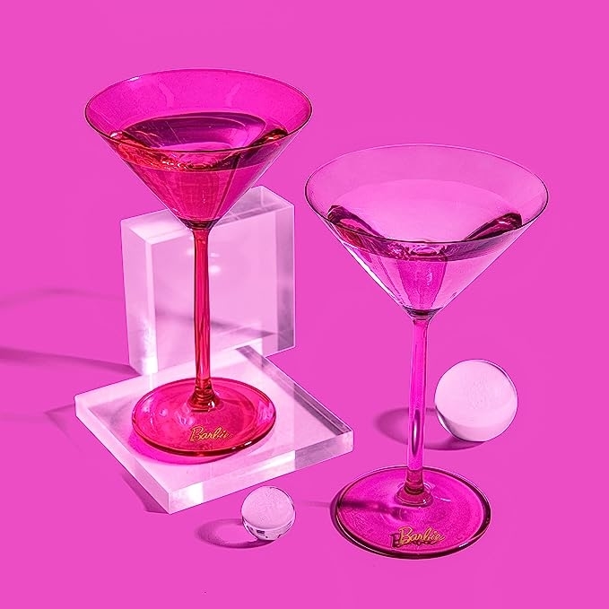 One hot pink and one light pink stemmed translucent martini glass with a small Barbie label on the base