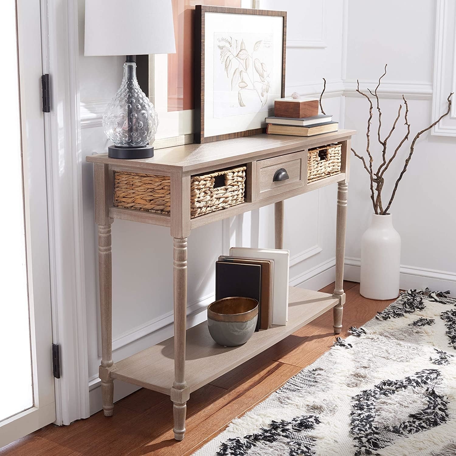 three drawer entryway table with two wicker baskets