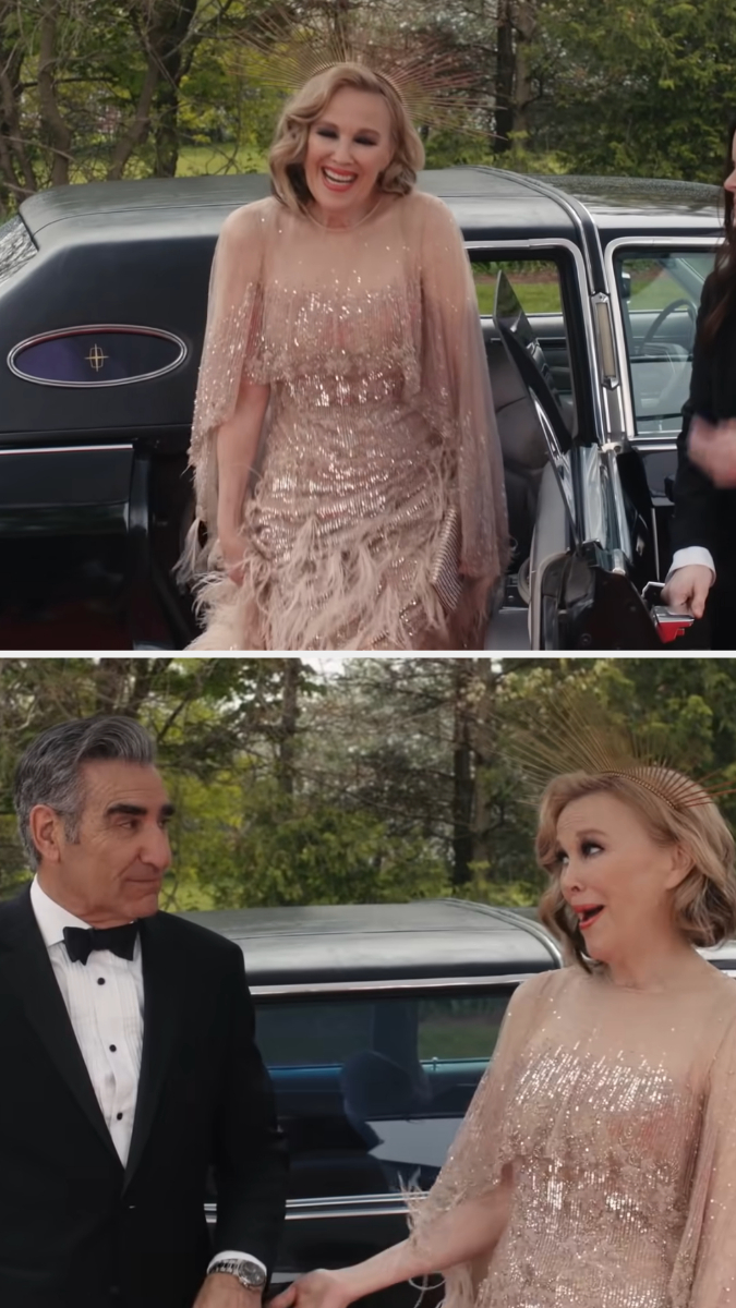 Moira shows up to her premiere wearing a floor length feathered blush gown
