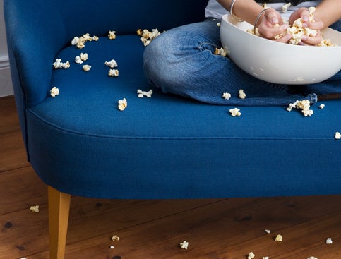 popcorn everywhere on a sofa