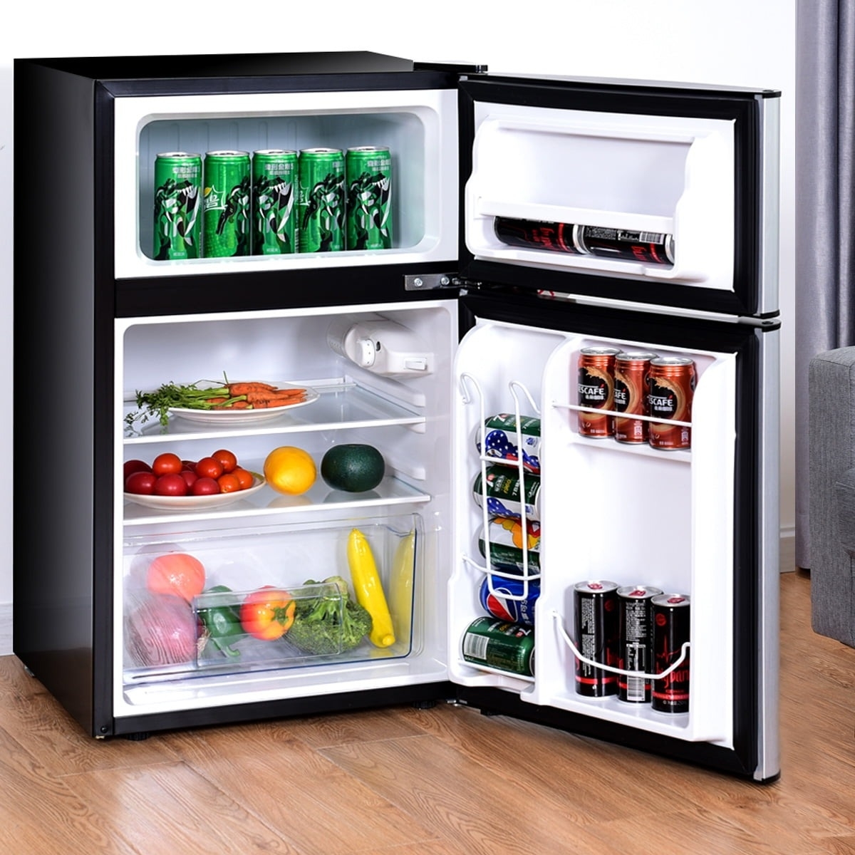 the black fridge with produce and cans inside