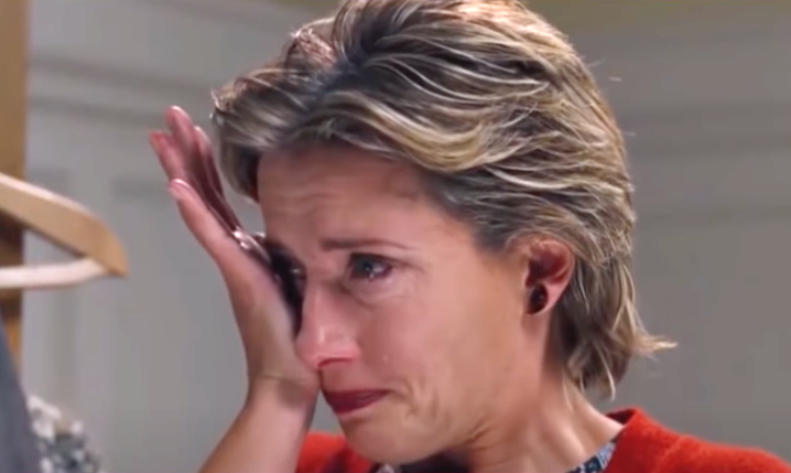 woman wiping her tears