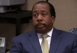 A GIF image of Stanley from The Office looking unimpressed
