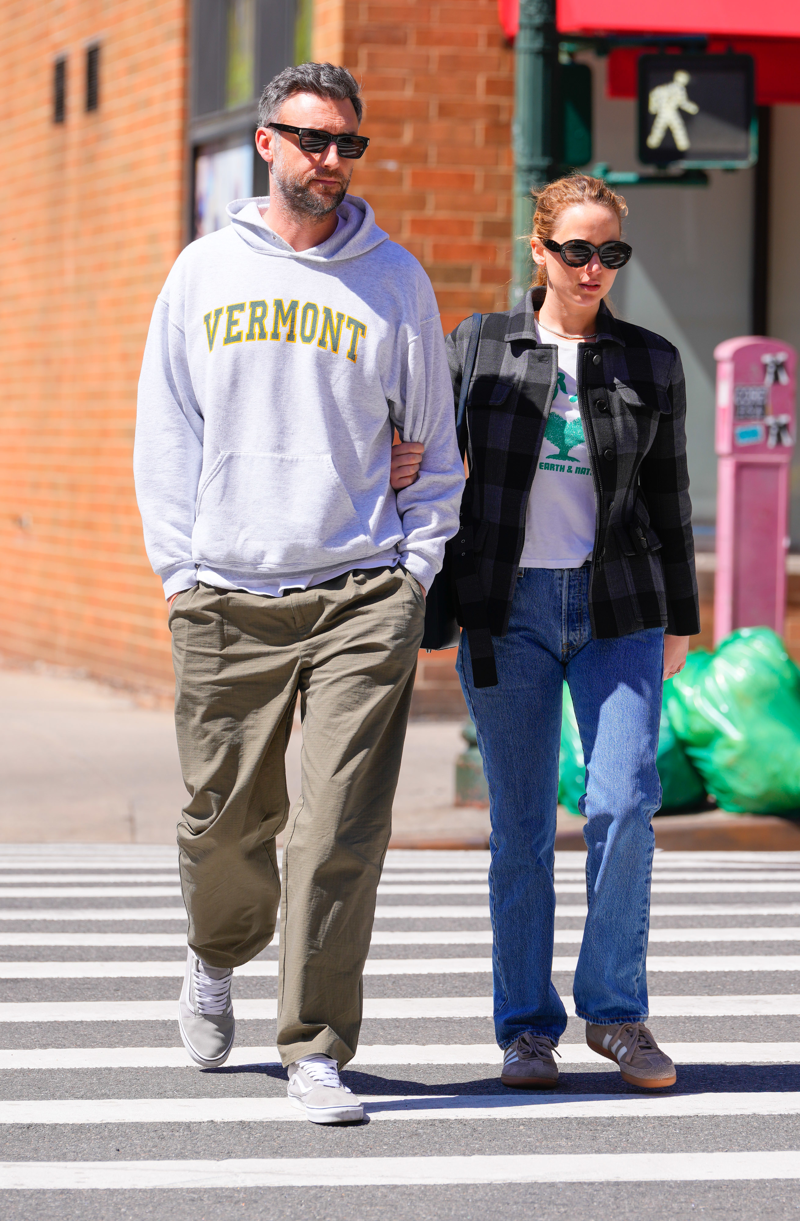Close-up of Cooke and Jennifer walking on the street