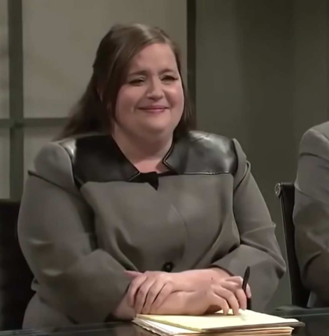 Close-up of Aidy Bryant smiling slightly