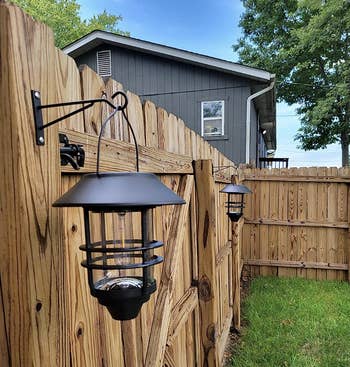Reviewer's lanterns bent connected a fence