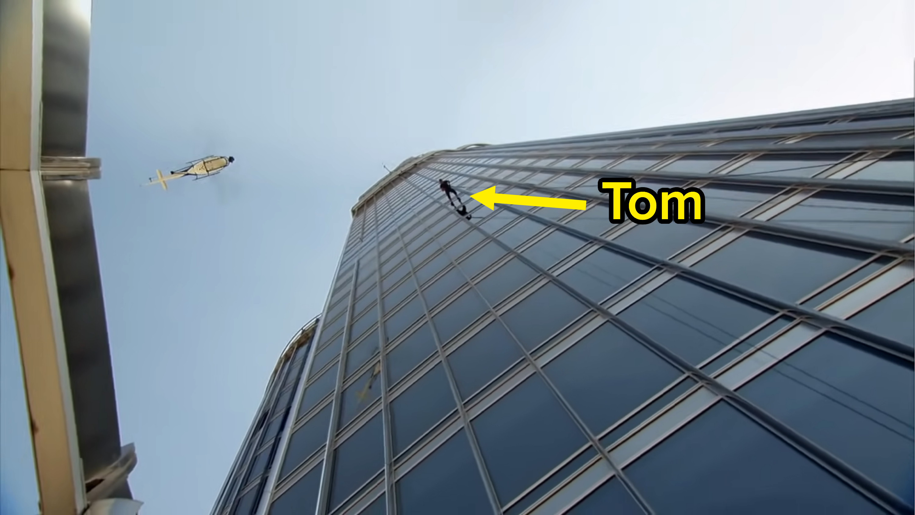 Tom on the side of the building, seen from the bottom