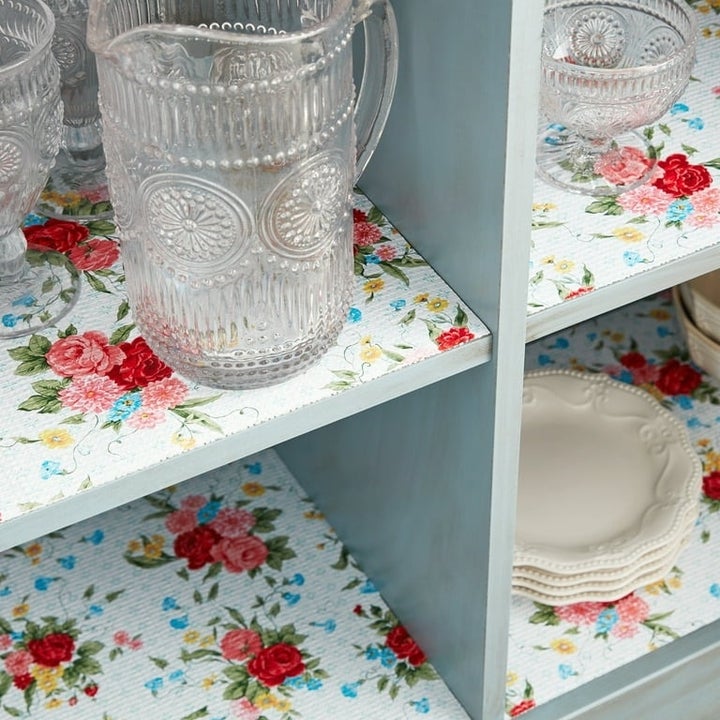 the floral-print liner lining several shelves