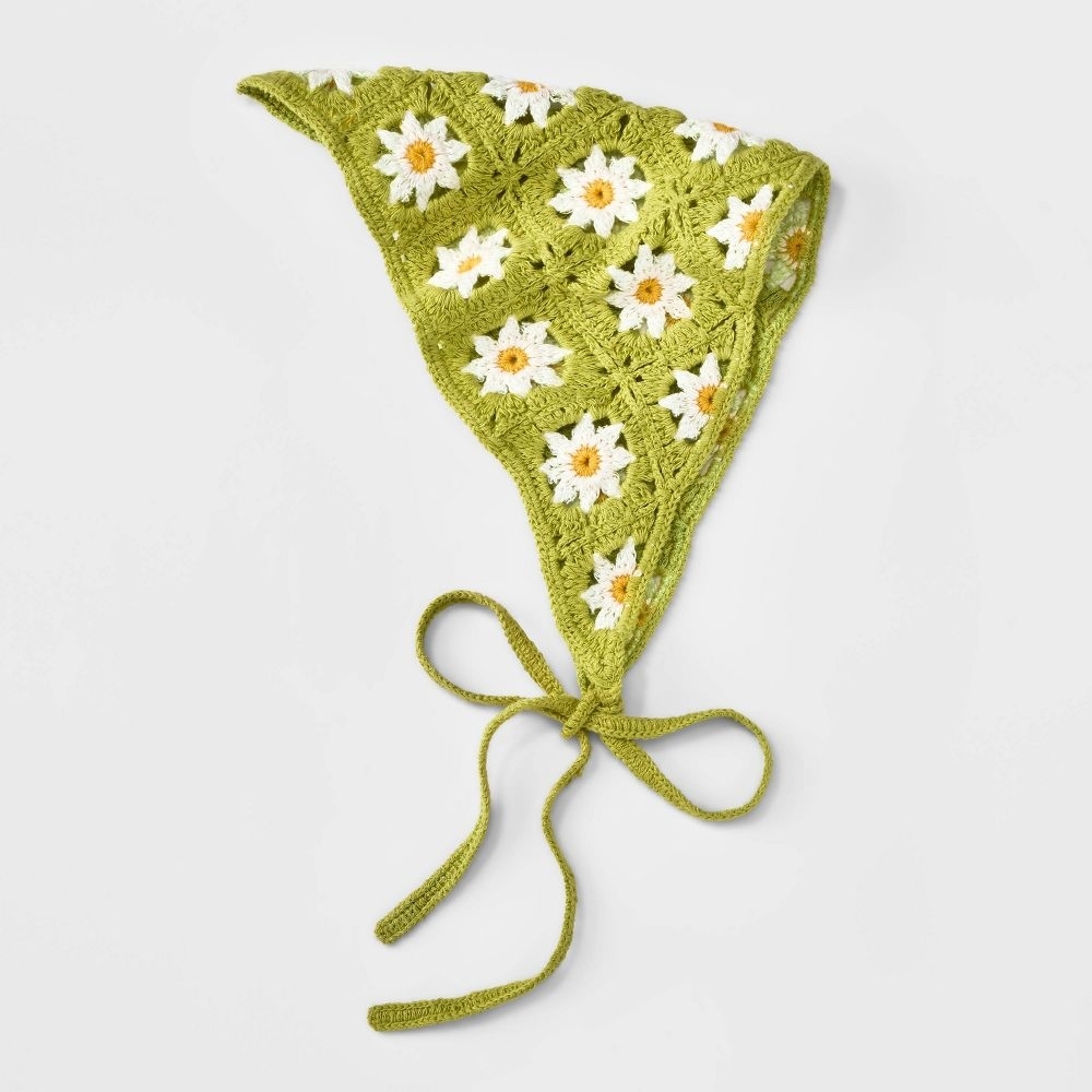 A picture of the green headband with daisy embroidery