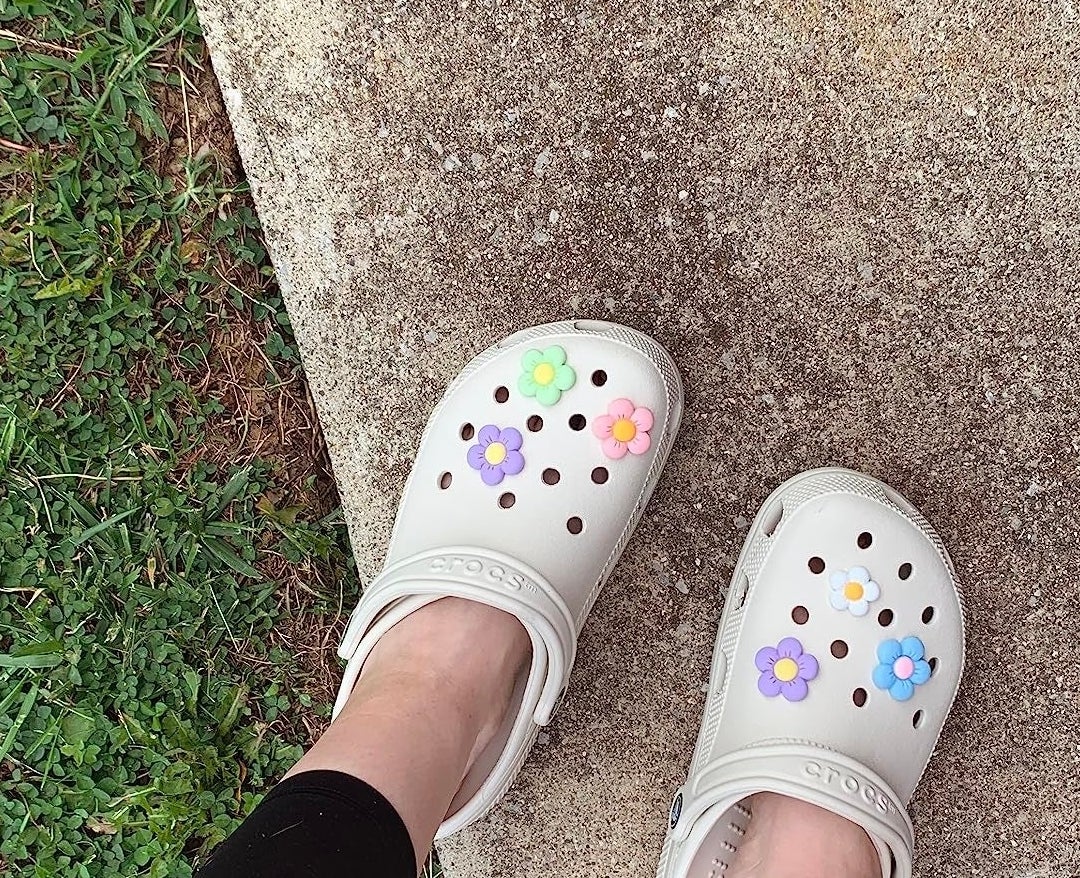 The off white crocs on a reviewer&#x27;s feet