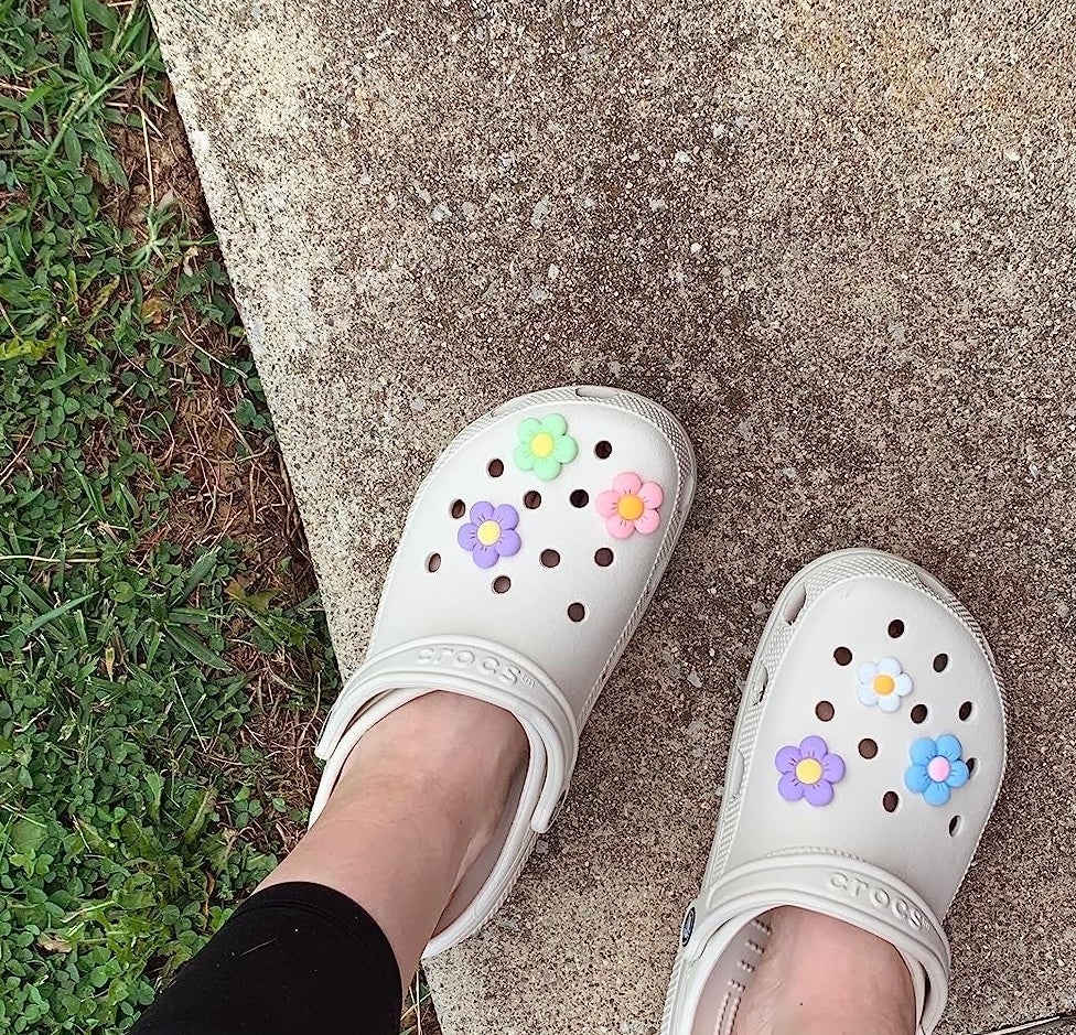 The off white crocs on a reviewer&#x27;s feet