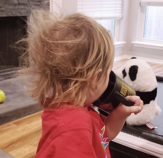 the back of a reviewer's child showing bed head