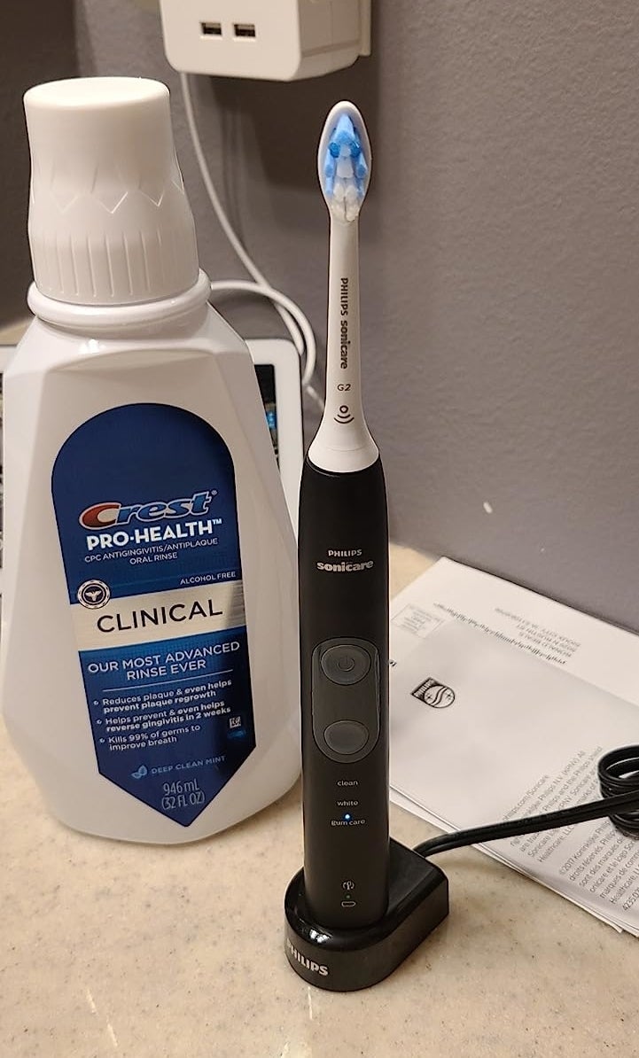 a reviewer photo of the toothbrush in its charging dock