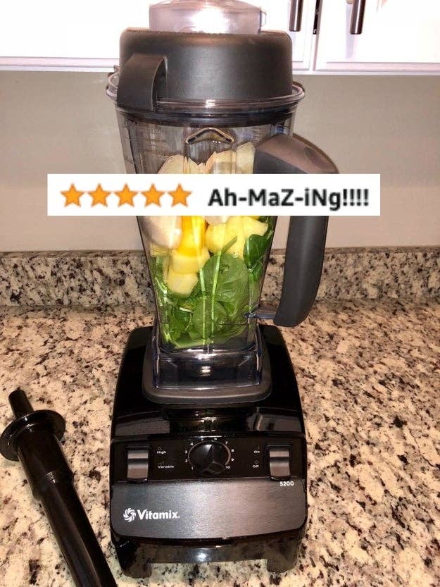 Reviewers blender with fruit and spinach and five-star review text &quot;ah-maz-ing!&quot;