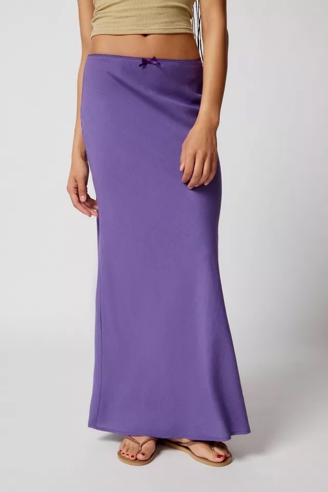 A model wearing a purple maxi skirt