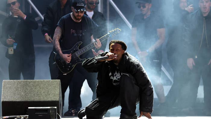 carti is pictured with guitarist