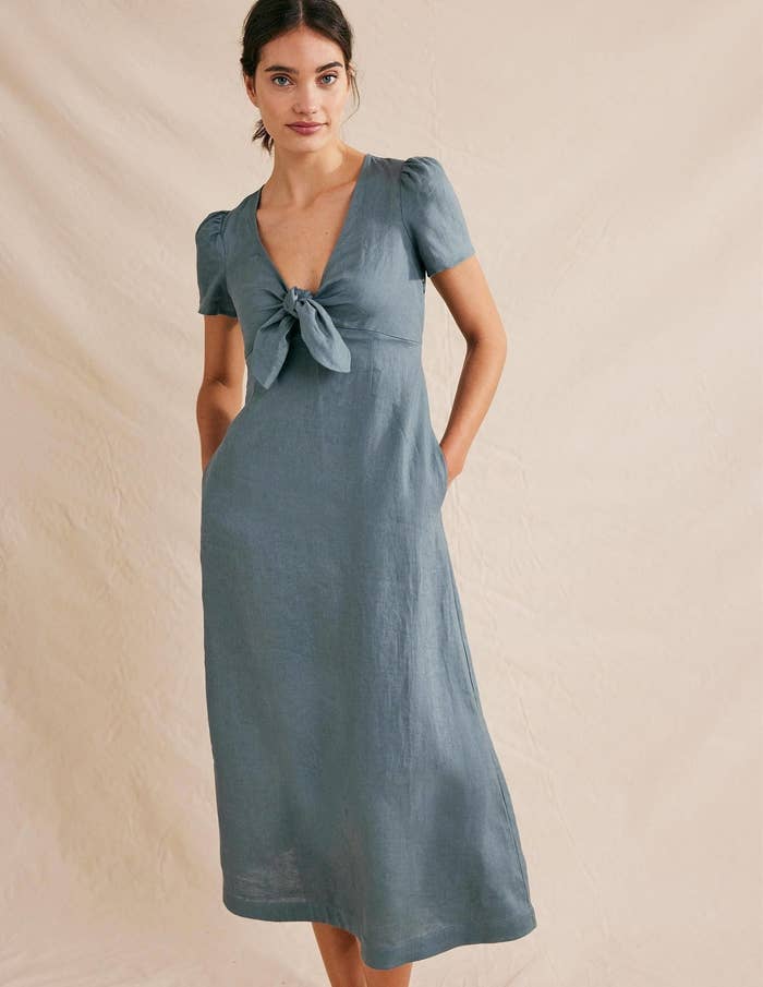 A model wearing a blue dress.