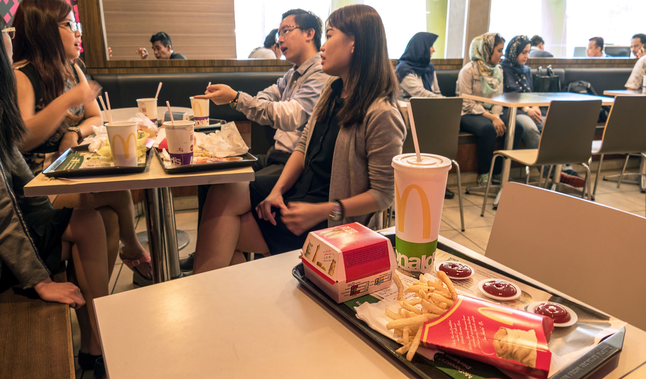 McDonald&#x27;s customers eating at a table