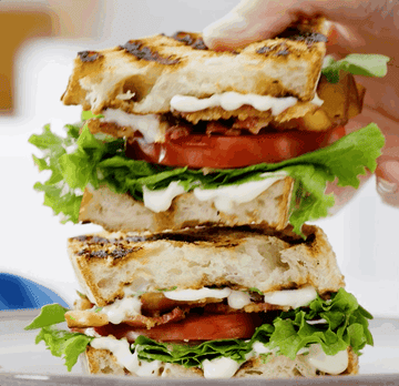 gif of a hand putting a BLT sandwich on top of another