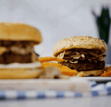 a juicy burger on a board