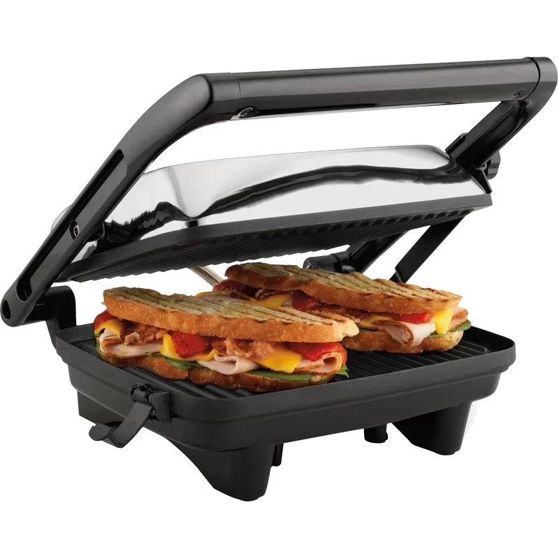 Panini press with sandwiches inside