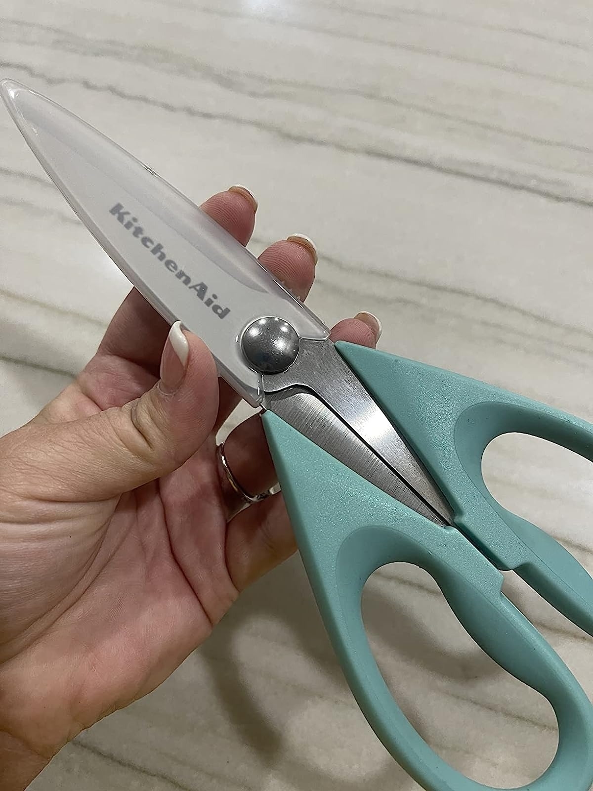 a reviewer holding up the aqua shears