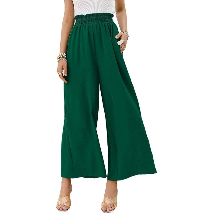 model wearing emerald green loose wide leg pants and sandals