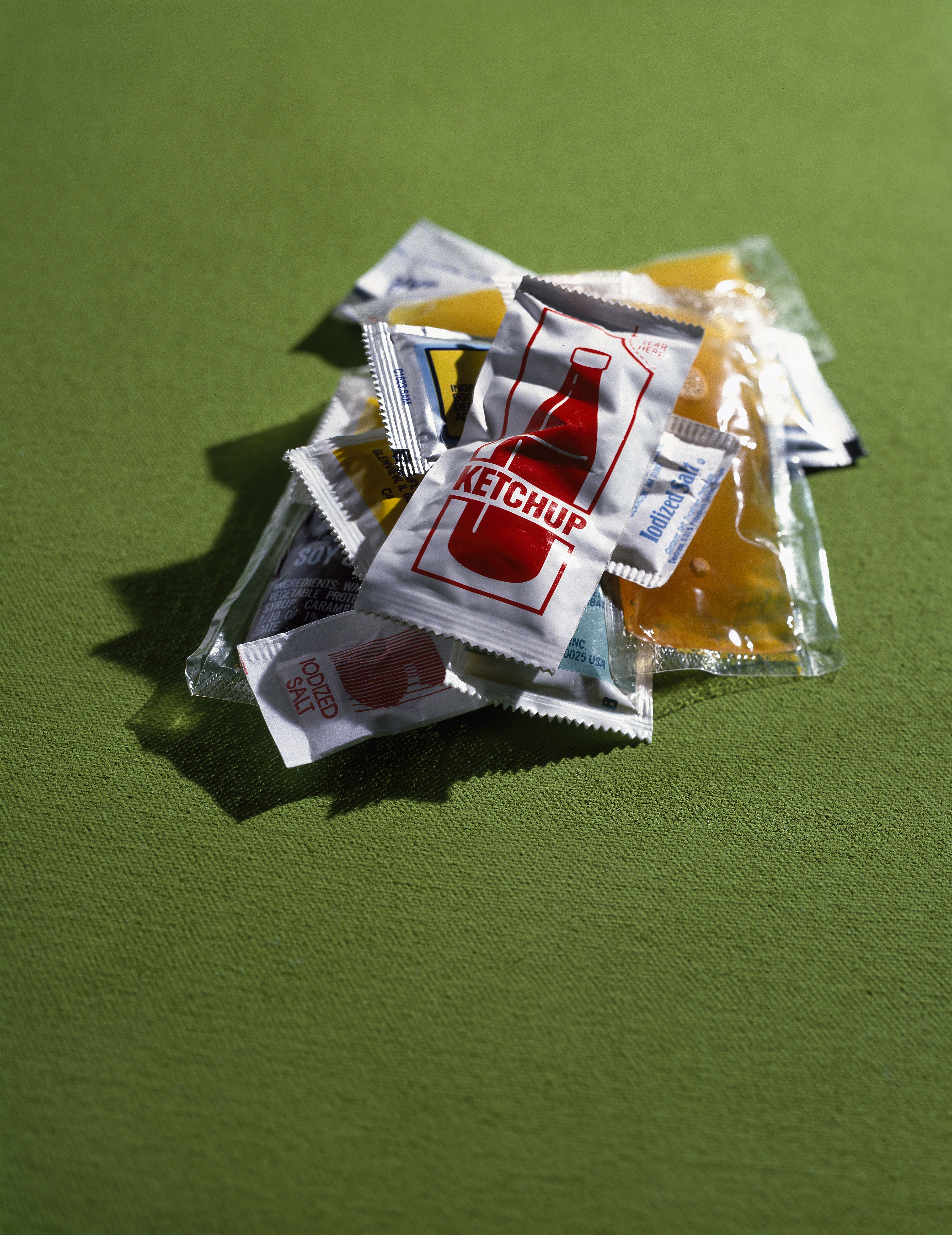 pile of takeout sauce packets