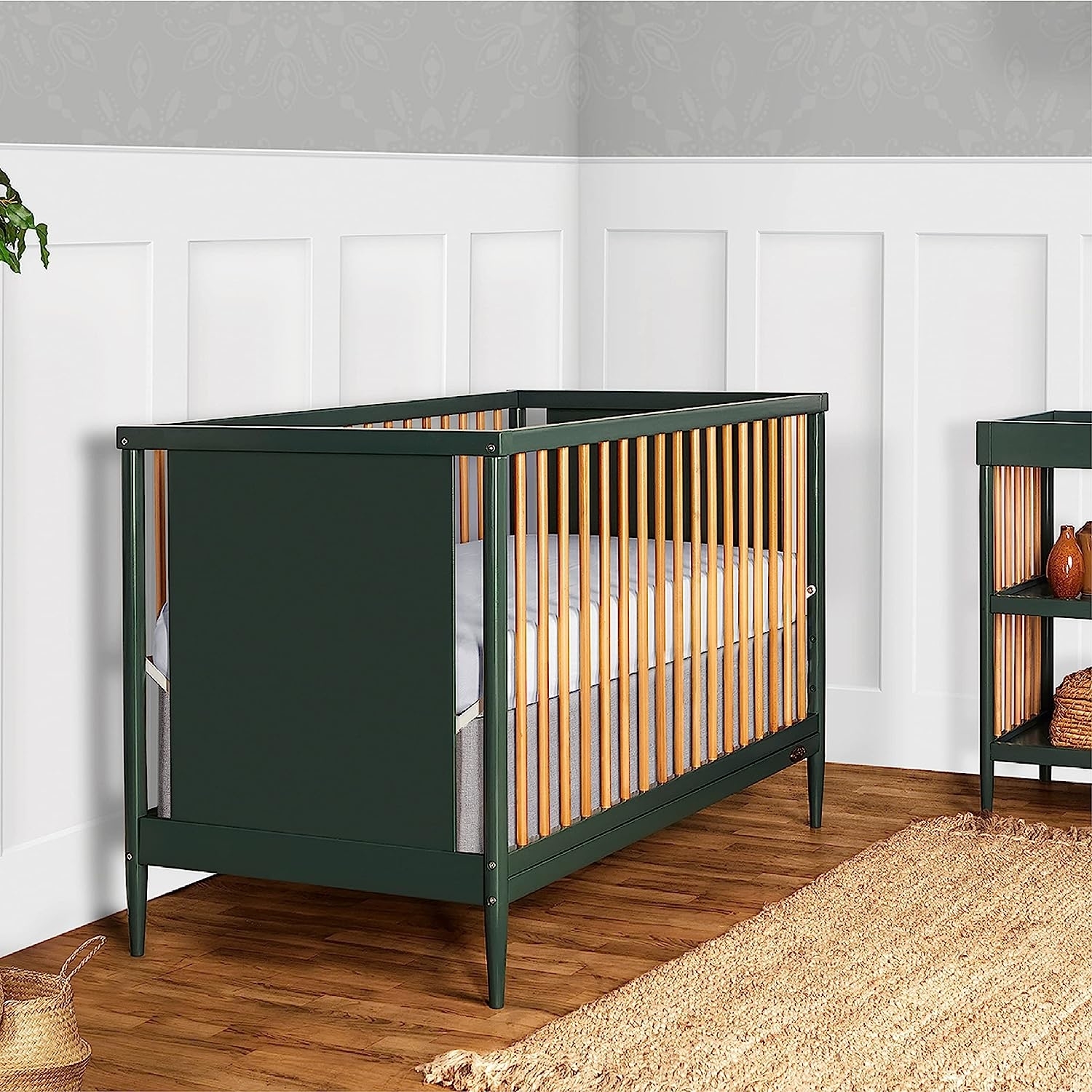 natural wood and green crib in nursery