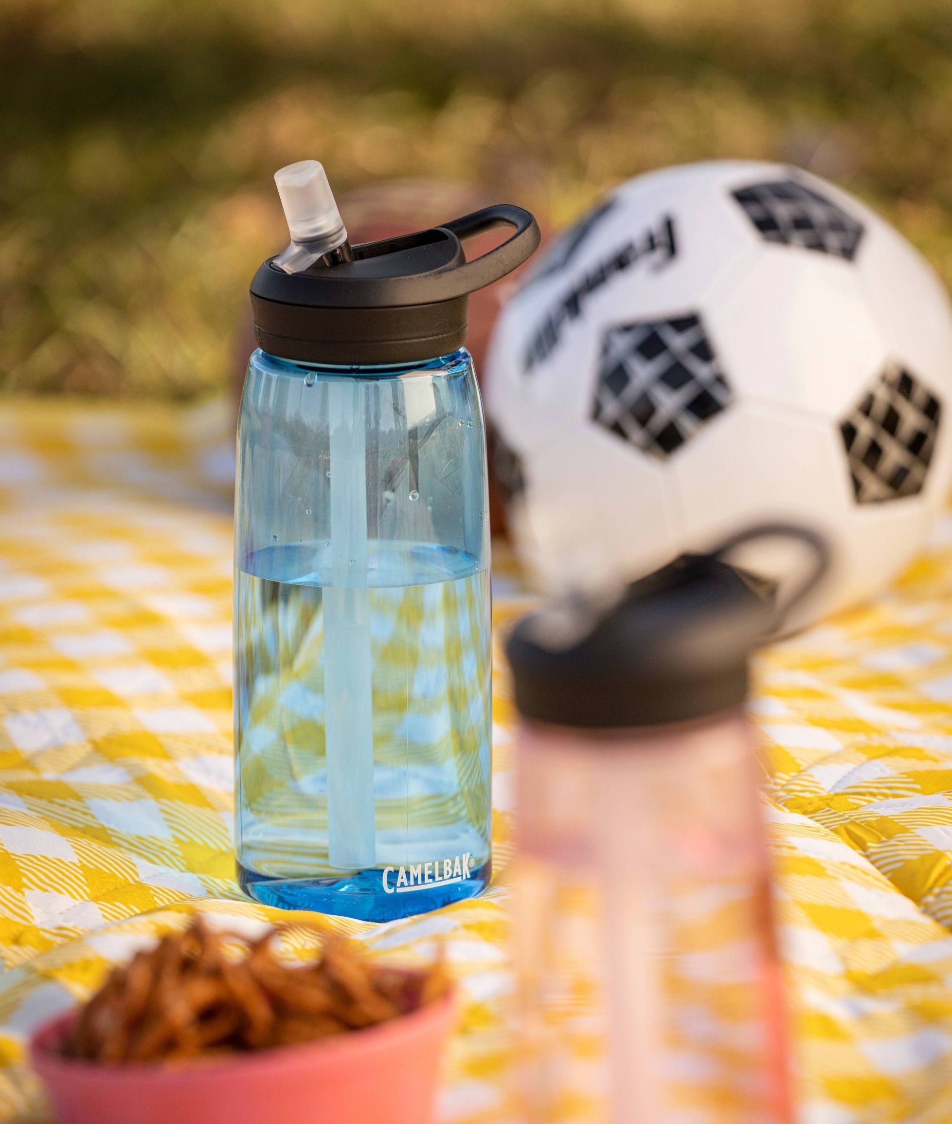 blue clear camelbak water bottle with a straw lid
