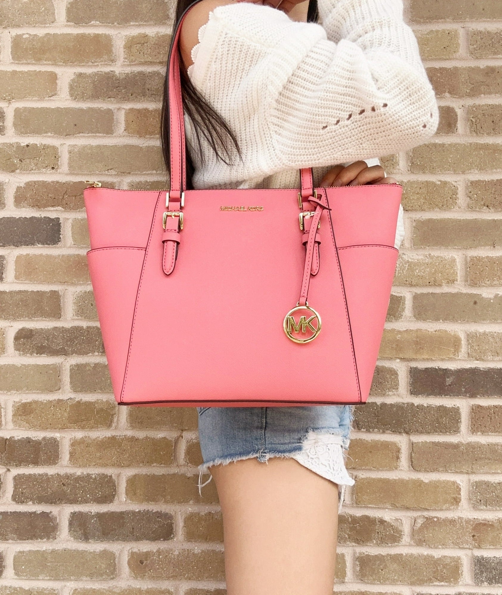 Image of model wearing pink bag