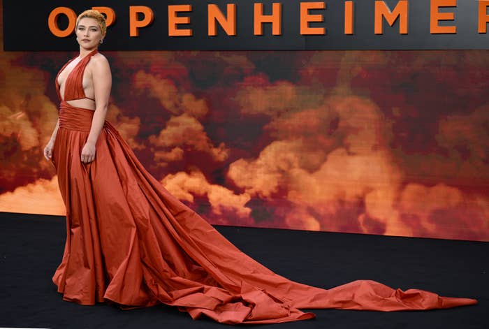 florence pugh at the premiere of Oppenheimer in a low-cut gown with a long train