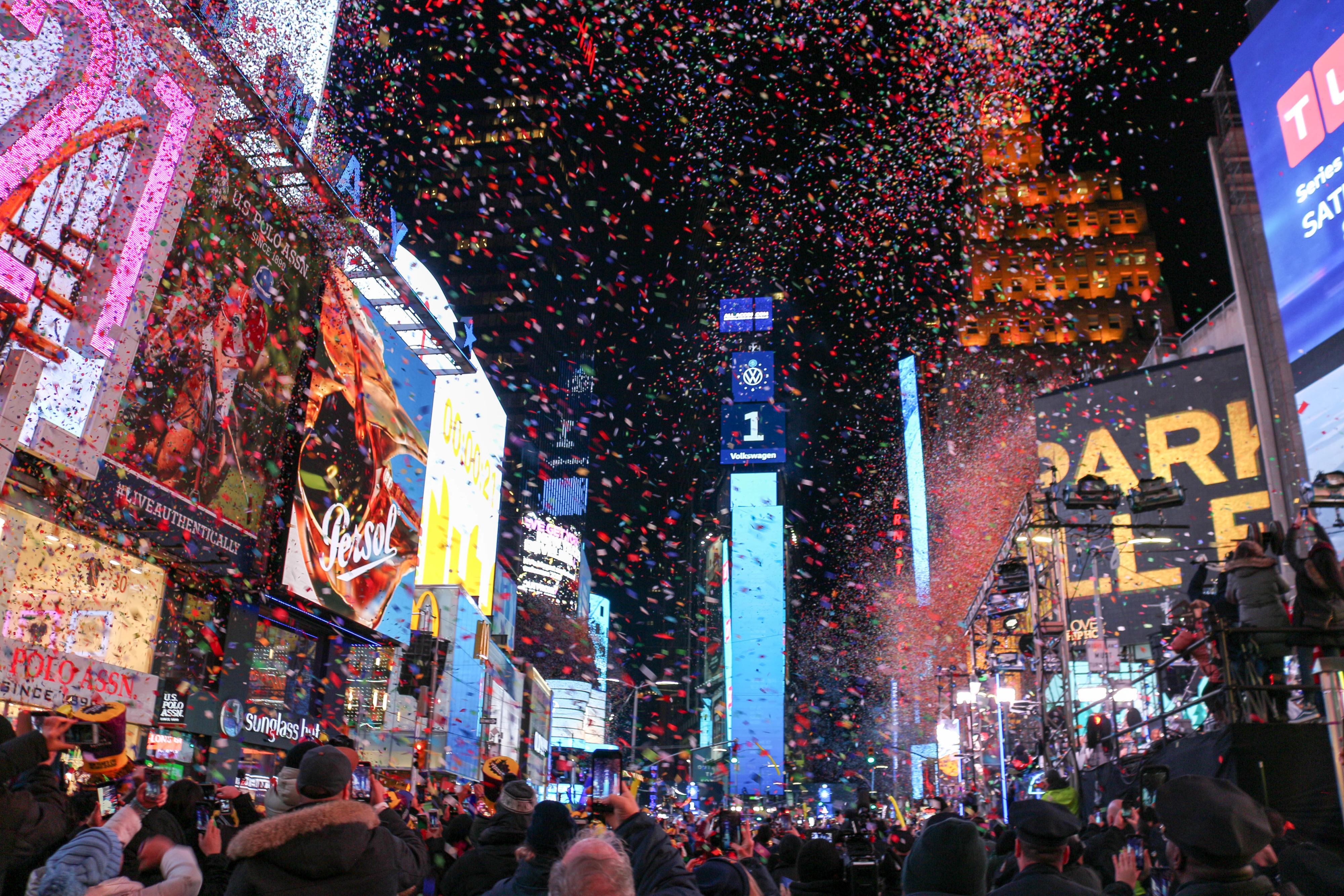 Times Square with colorful confetti raining down from the sky