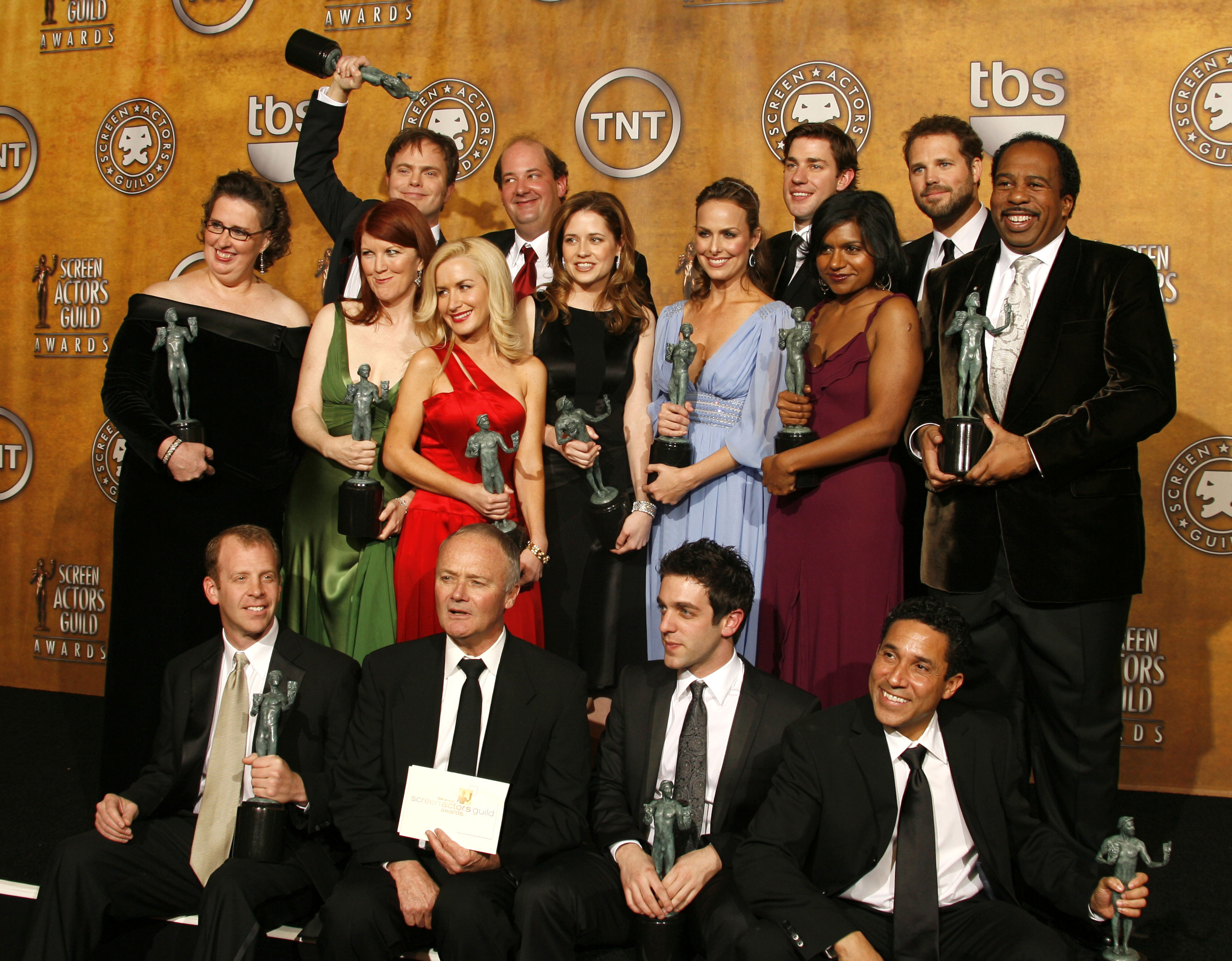 the cast of the office at the Screen Actors Guild Awards holding their trophies