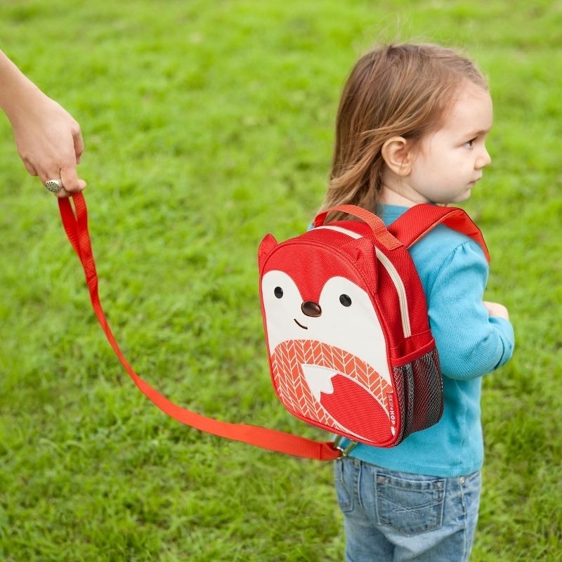 Child model uses a backpack with a strap