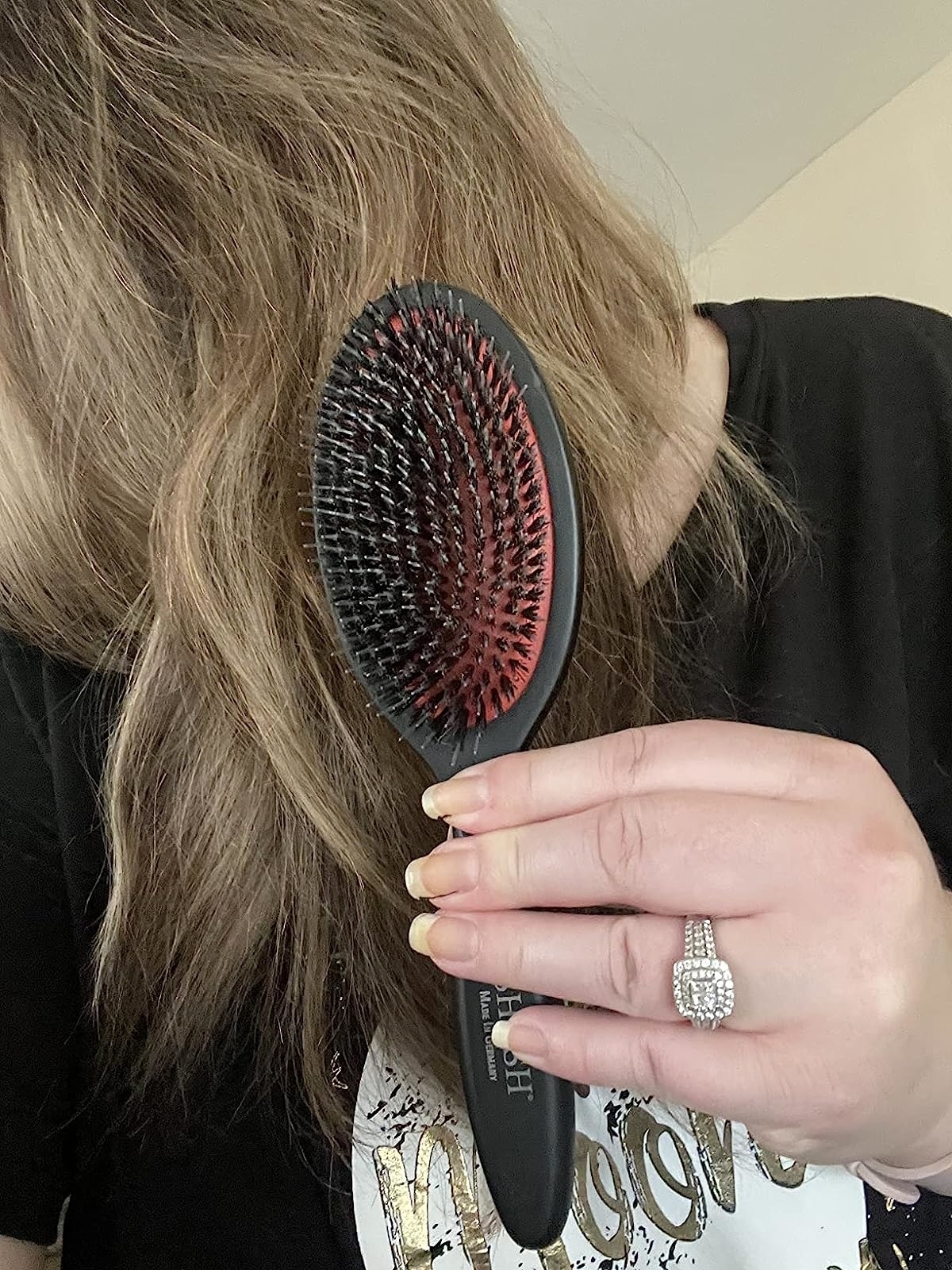 the black and red brush in a reviewer&#x27;s hand
