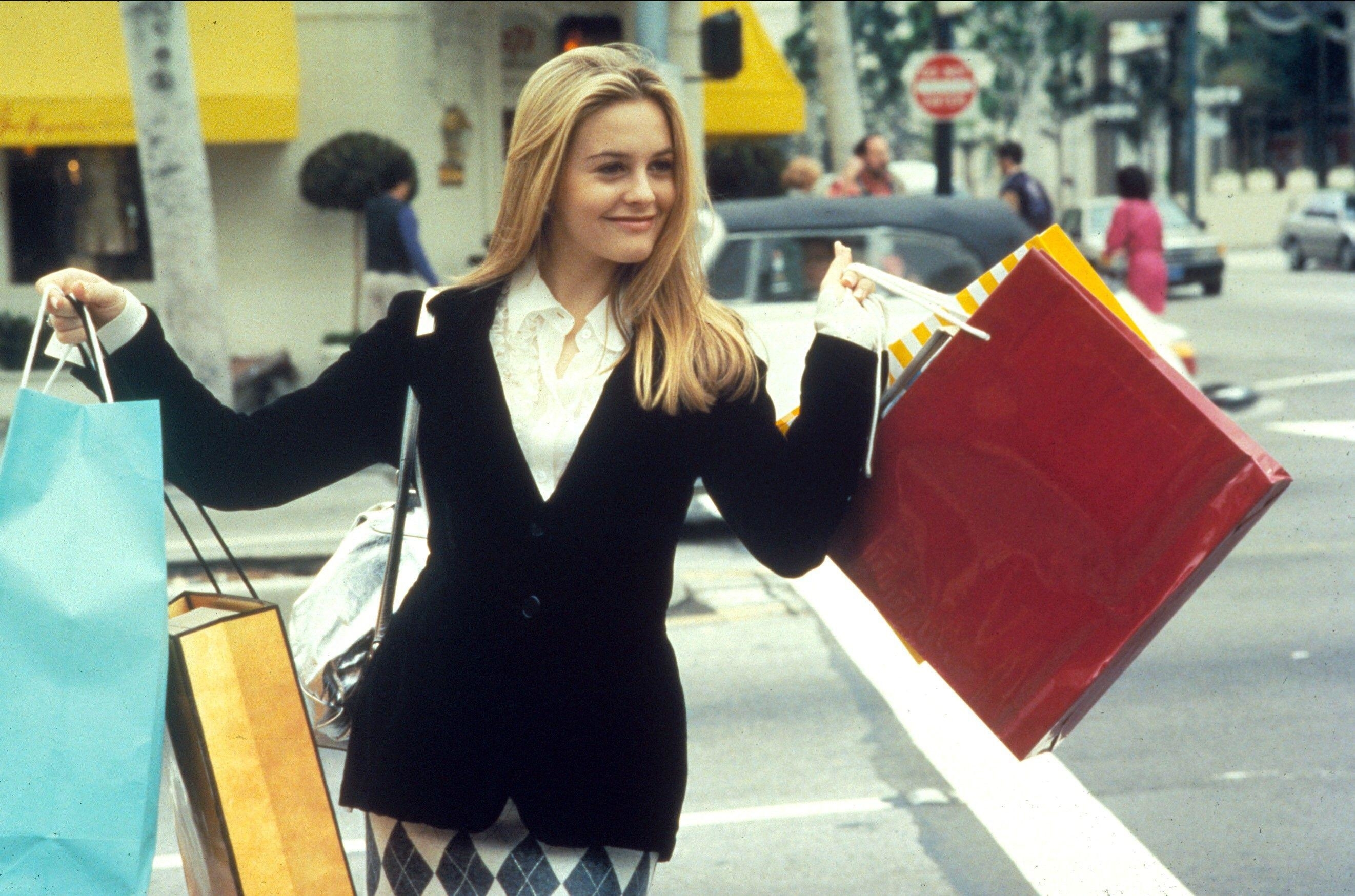 Cher walking around with shopping bags in Clueless
