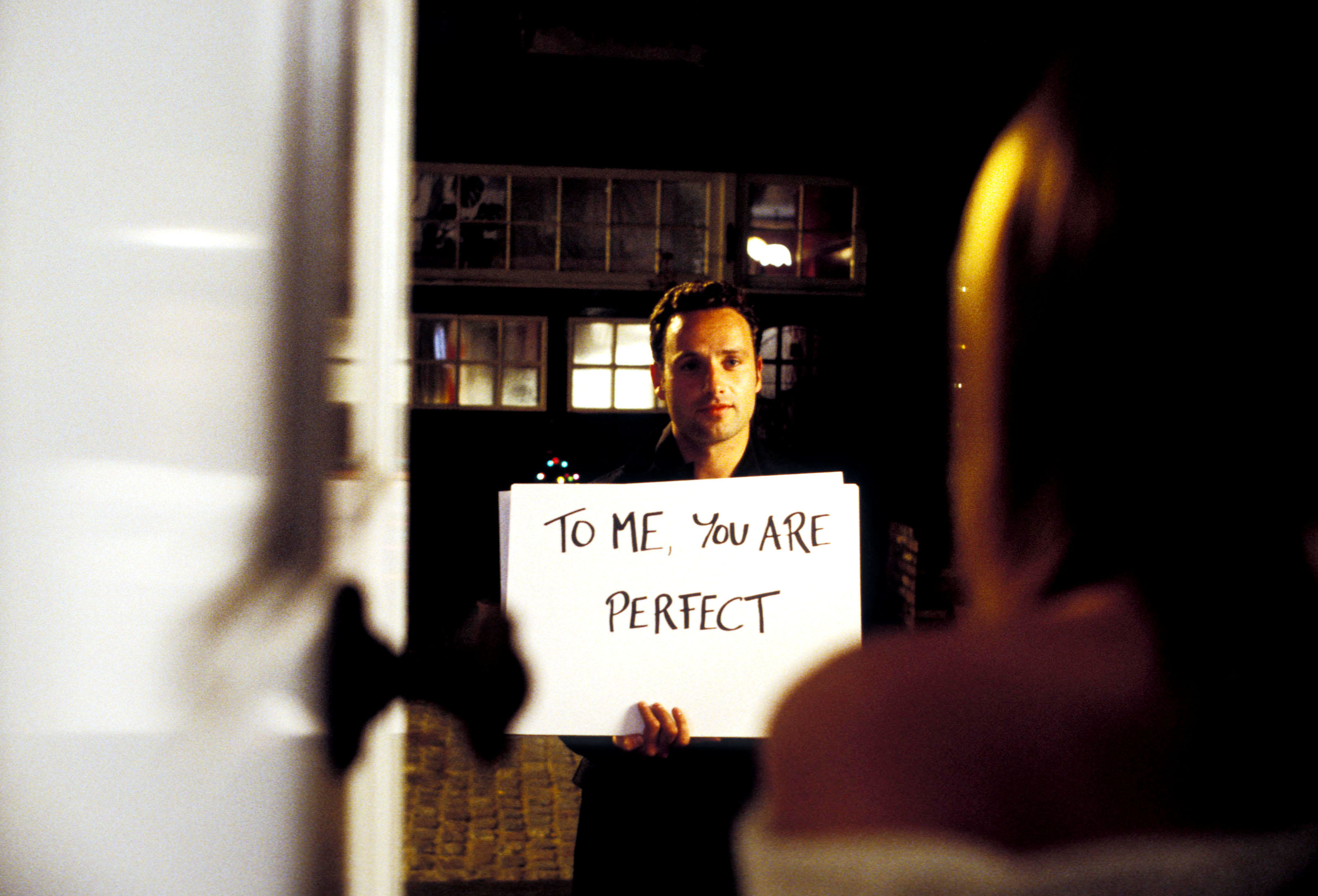 Andrew Lincoln holding a sign that says &quot;To me, you are perfect&quot; in Love, Actually
