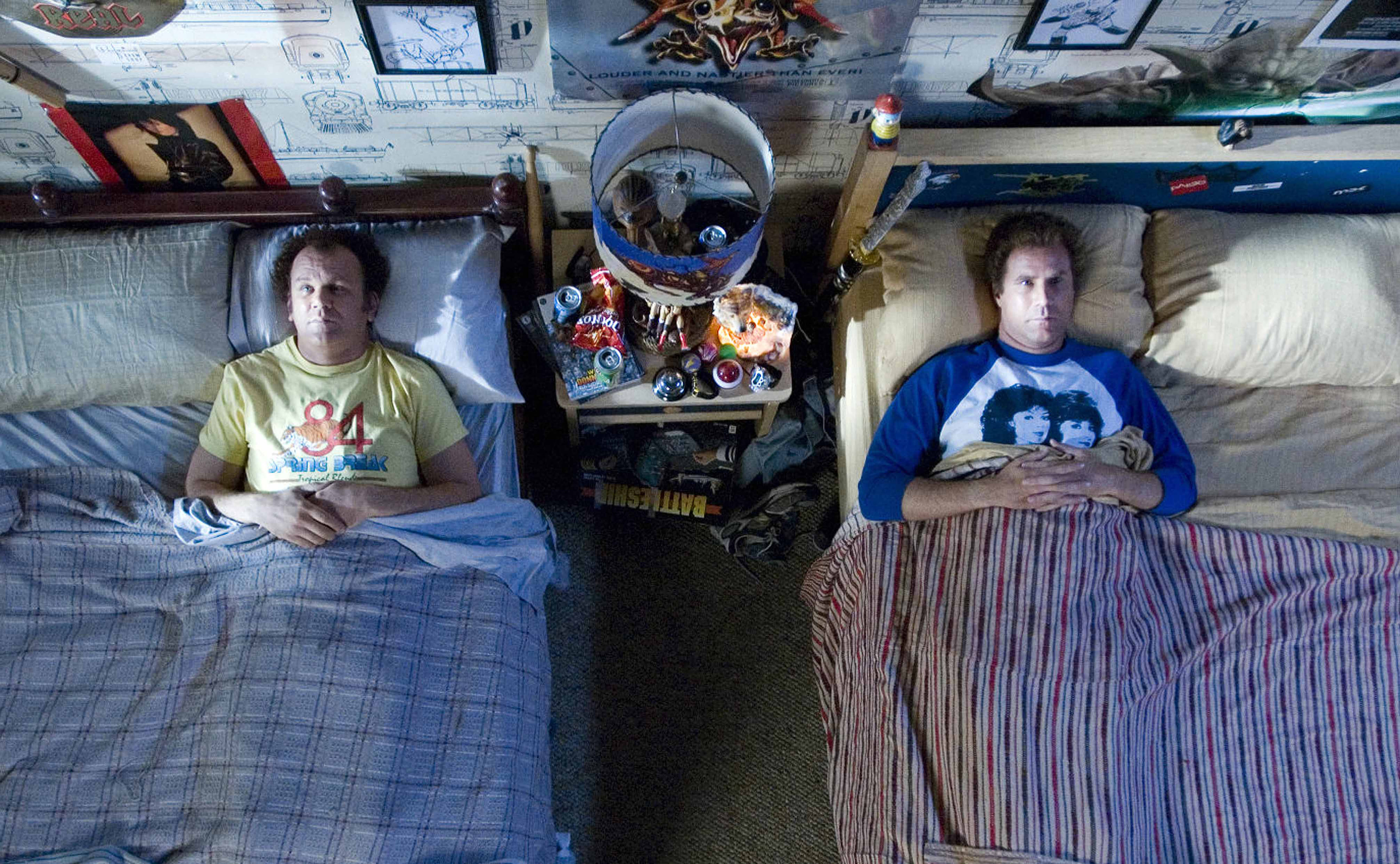Will Ferrell and John C. Reilly laying in two different beds in Step Brothers