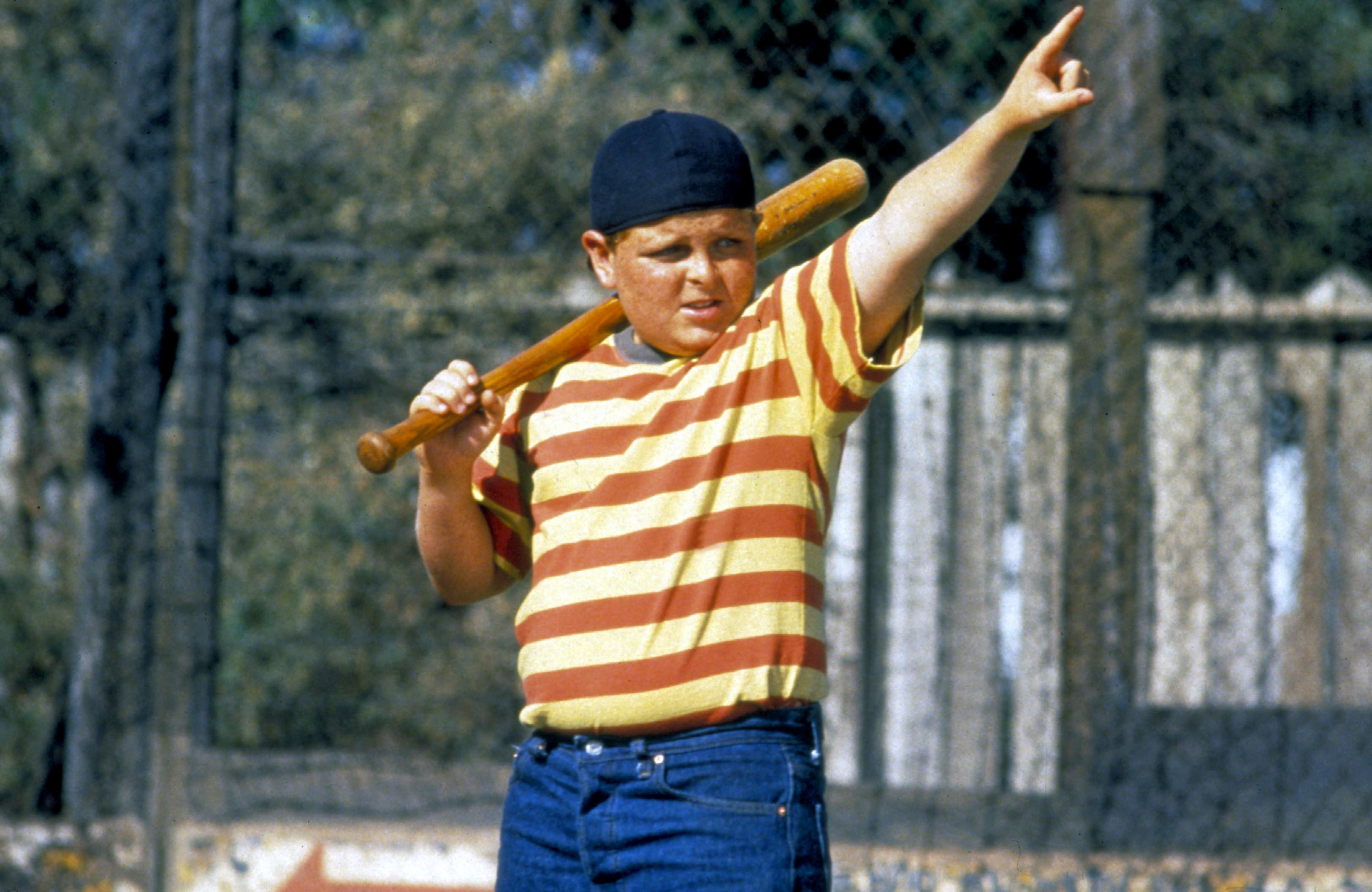 Patrick Renna getting ready to play baseball in a striped shirt during a scene in The Sandlot