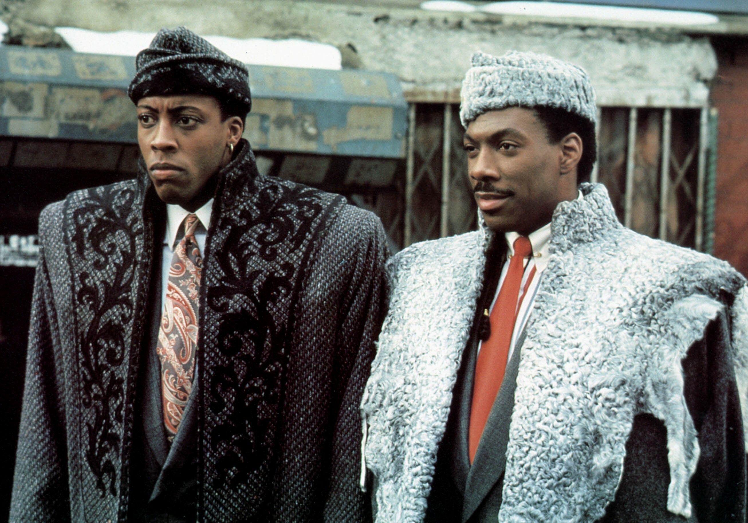 Arsenio Hall and Eddie Murphy in big jackets and hats in Coming to America