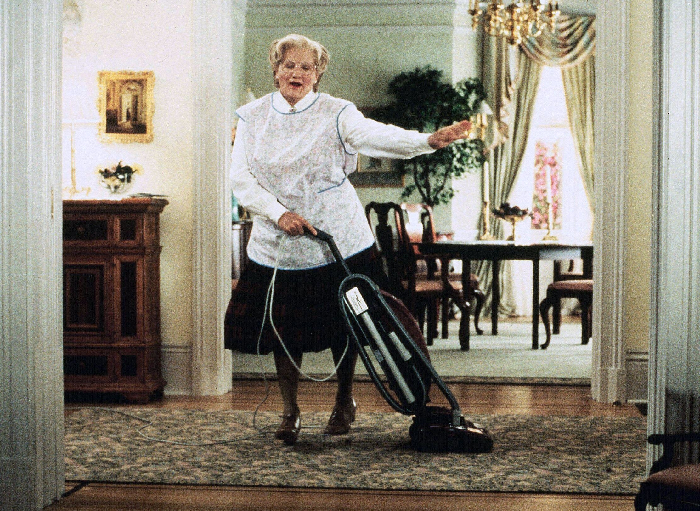 Robin Williams dancing with a vacuum and dressed as an old lady in Mrs. Doubtfire