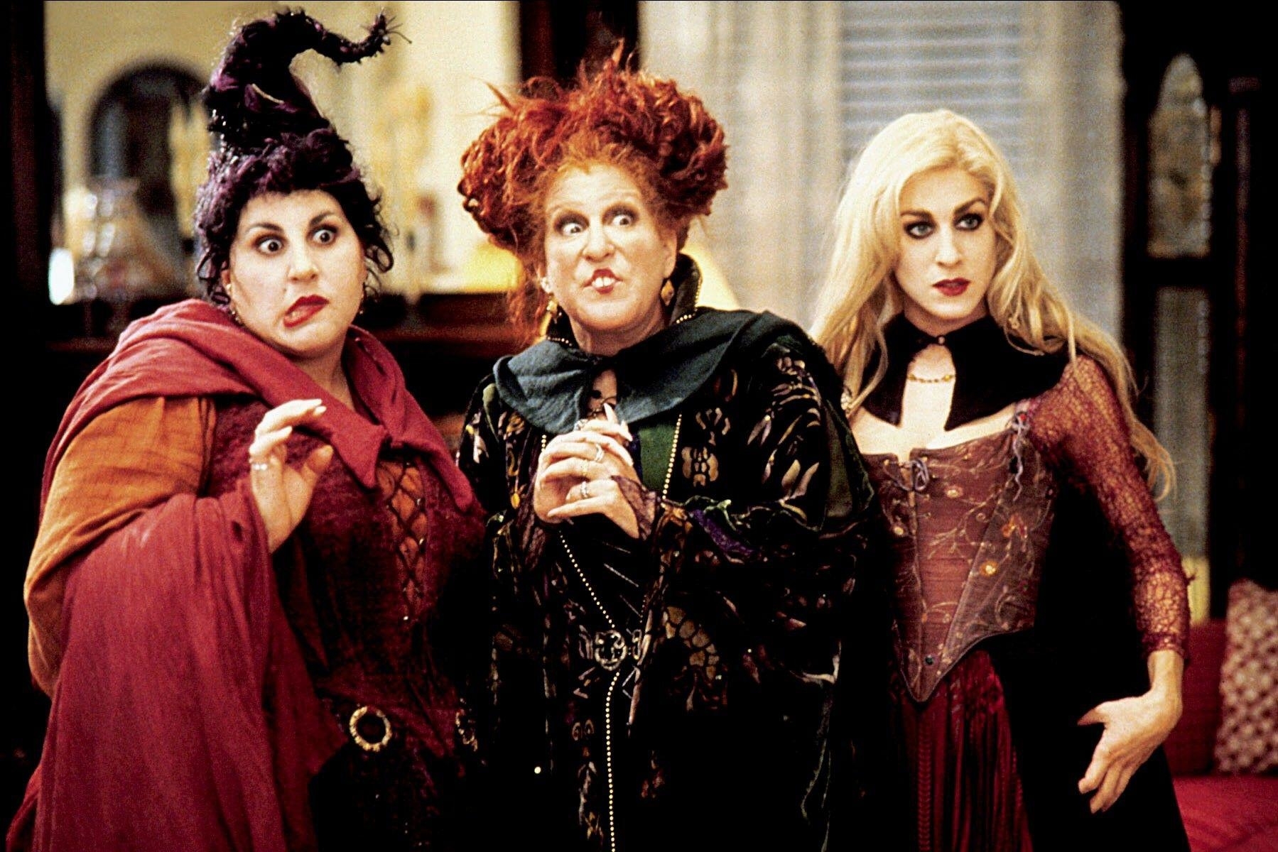 Kathy Najimy, Bette Midler, and Sarah Jessica Parker dressed as witches in Hocus Pocus