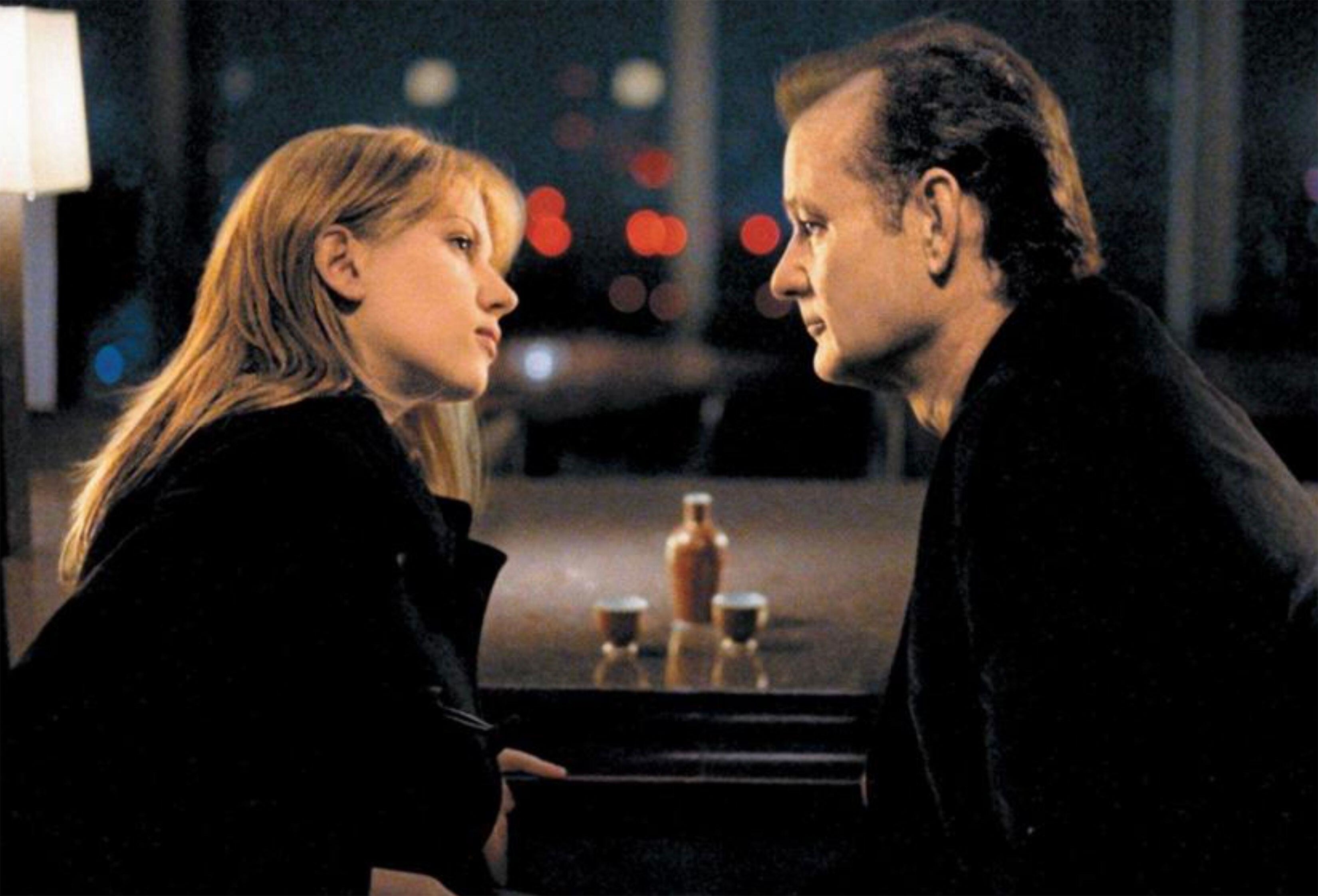 Scarlett Johansson and Bill Murray sitting at a table in Lost in Translation