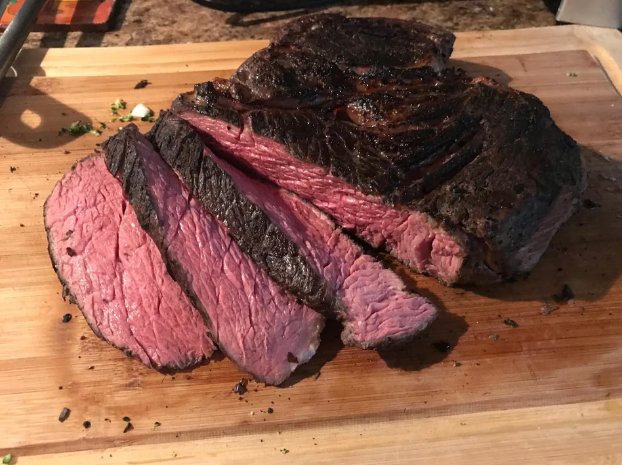 sliced chuck roast with a perfectly red center